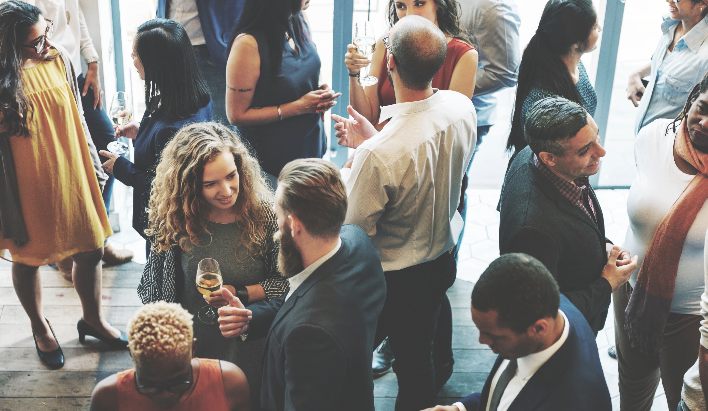 Four business professionals collaborating in a modern office space